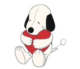 Peluche Snoopy abrazando un corazón