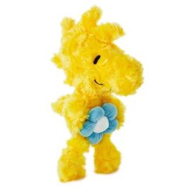 Peluche Woodstock sosteniendo una flor de peluche